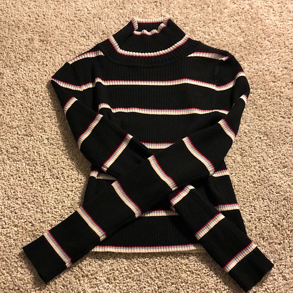 Black with red blue and white stripes. Long sleeve.